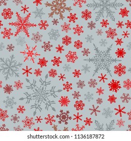 Christmas seamless pattern of snowflakes, red and gray on light blue background.