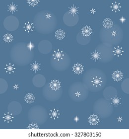 Christmas seamless pattern with snowflakes and sparkles.