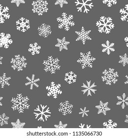 Christmas seamless pattern of snowflakes, white on gray background