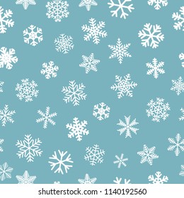 Christmas seamless pattern of snowflakes, white on light blue background