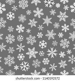 Christmas seamless pattern of snowflakes, white on gray background