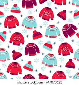 Christmas seamless pattern with snowflakes, woolen hats and knitted sweaters on white background. Perfect for wallpaper and greeting cards 