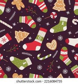 Christmas seamless pattern with socks, lollipops, gingerbread and snowflakes.