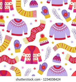 Christmas seamless pattern with sweater, woolen hat, mittens, scarf, stars, fir branches on white background. Perfect for holiday invitations, winter greeting cards, wallpaper and gift paper 