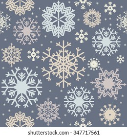 Christmas seamless pattern with variegated colorful snowflakes. 
Stylish background for your creative designs.