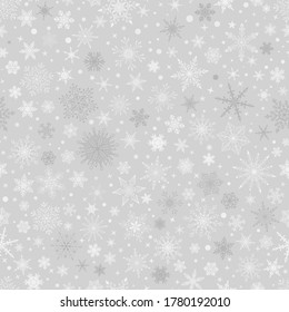 Christmas seamless pattern with various complex big and small snowflakes, white on gray background