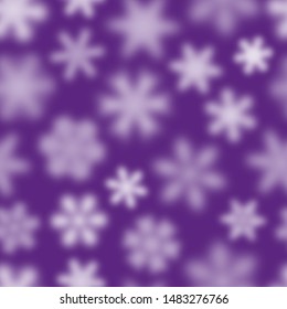 Christmas seamless pattern of white defocused snowflakes on purple background