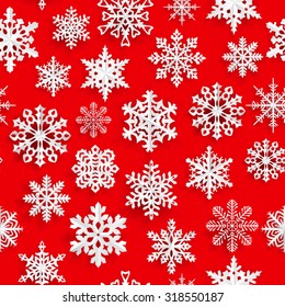 Christmas seamless pattern with white paper snowflakes on red background