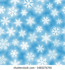 Christmas seamless pattern of white snowflakes of different shapes on light blue background