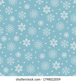 Christmas seamless pattern with white snowflakes on light blue background. Perfect for winter holidays, gift paper, wallpaper, New Year greeting cards. Vector illustration 