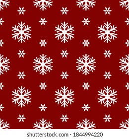 Christmas seamless pattern with white snowflakes on red background. Wrapping paper, gift wrapper, greeting, backgrounds, textile