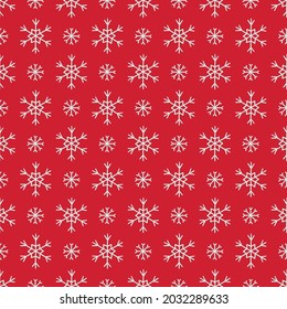 Christmas seamless pattern with white snowflakes on red background. Scandinavian style. Perfect for winter holidays, xmas wallpaper, wrapping paper, fabric. Vector illustration
