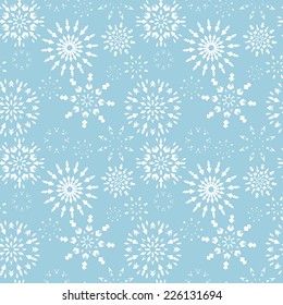 Christmas seamless pattern. White snowflakes in dusk. Winter theme retro texture. Snowflake silhouettes on soft blue background. Vector illustration.