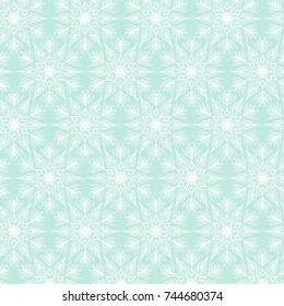Christmas seamless pattern with white snowflakes on green background