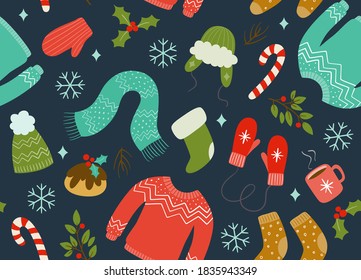 Christmas seamless pattern with winter clothes and accessories. Dark blue background. Keep warm concept. EPS 10 vector illustration.