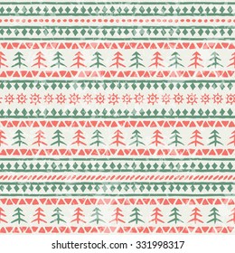Christmas seamless pattern with xmas trees and geometric ornament. Primitive ethnic (tribal) style with hand drawn ornament. Red and green palette with a grunge texture