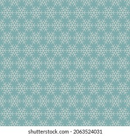 Christmas seamless patterns with snowflakes on a blue background. Winter hand drawn background. Vector illustration.