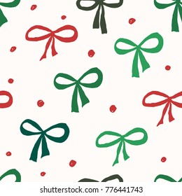 Christmas seamless repeat pattern with green and red bows and dots on white background. Holiday gift wrap, greeting card, wallpaper design.