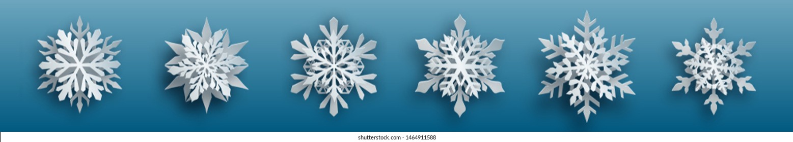 Christmas set of white complex paper snowflakes with soft shadows on light blue background