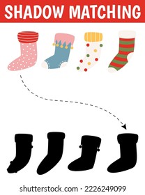 Christmas shadow matching activity for children. Winter puzzle with cute socks. New Year educational game for kids. Find the correct silhouette printable worksheet.