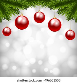Christmas shiny card with fir tree branch and Christmas baubles
