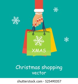 Christmas shopping. Girl, woman hold in hand packages, gifts. Big Christmas sales. Vector illustration flat style design. Discounts for holidays. Buyer with many packages.