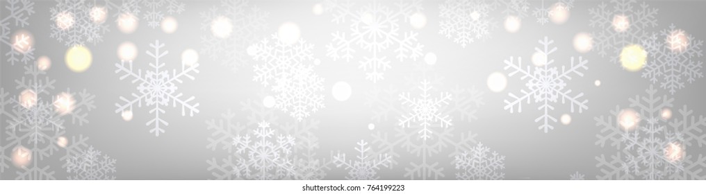 Christmas silver background with glowing snowflakes and bokeh