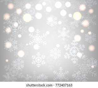 Christmas silver background with glowing snowflakes and bokeh