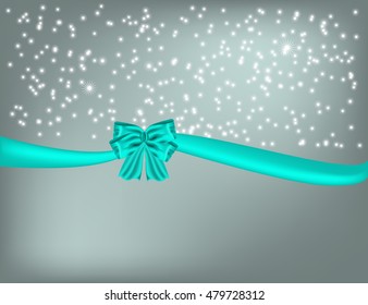 Christmas silver background with white snowflakes and blue ribbon with bow