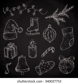 Christmas sketches set. Vector doodles of light, socks, gift, mitten, candle, bell, branch, candy, ball, hat, ice skate on chalkboard
