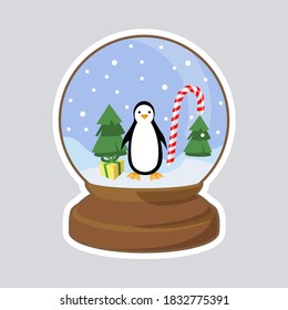 Christmas snow dome with penguin, Christmas trees, gift and candy cane. Isolated vector illustration.