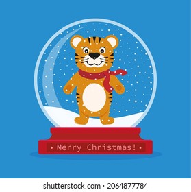 Christmas snow globe with a tiger inside. 