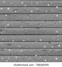 Christmas snow gray wooden background. Winter snowflakes wood backdrop