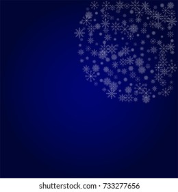 Christmas snow powder background of a random scatter snowflakes in blue. Snow explosion. Ice storm.