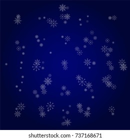 Christmas snow powder background of a random scatter snowflakes in blue. Snow explosion. Ice storm.