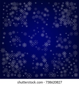 Christmas snow powder background of a random scatter snowflakes in blue. Snow explosion. Ice storm.