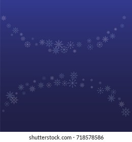 Christmas snow powder frame or border of a random scatter snowflakes on a blue background. Snow explosion. Ice storm.