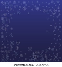 Christmas snow powder frame or border of a random scatter snowflakes on a blue background. Snow explosion. Ice storm.