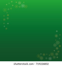 Christmas snow powder frame or border of a random scatter snowflakes on a green background. Snow explosion. Ice storm.