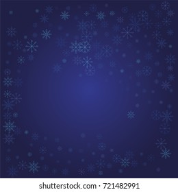Christmas snow powder frame or border of a random scatter snowflakes on a blue background. Snow explosion. Ice storm.