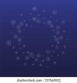 Christmas snow powder frame or border of a random scatter snowflakes on a blue background. Snow explosion. Ice storm.