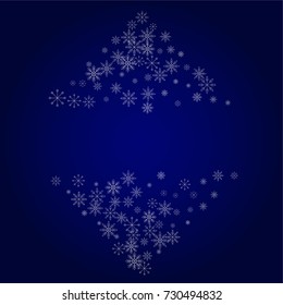 Christmas snow powder frame or border of a random scatter snowflakes in blue. Snow explosion. Ice storm.