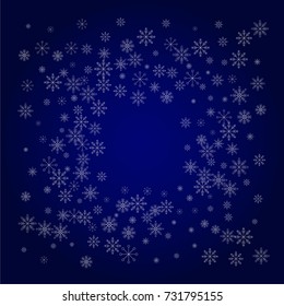 Christmas snow powder frame or border of a random scatter snowflakes in blue. Snow explosion. Ice storm.