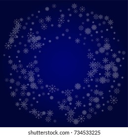 Christmas snow powder frame or border of a random scatter snowflakes in blue. Snow explosion. Ice storm.