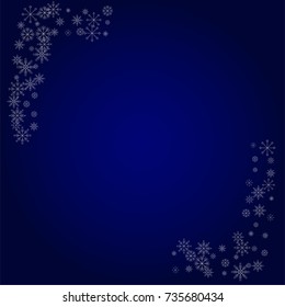 Christmas snow powder frame or border of a random scatter snowflakes in blue. Snow explosion. Ice storm.