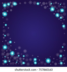 Christmas snow powder frame or border of a random scatter snowflakes on an indigo background. Snow explosion. Ice storm.