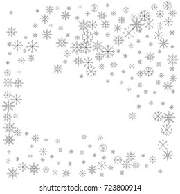 Christmas snow splash frame or border of a random scatter snowflakes isolated on white. Snow explosion. Ice storm.