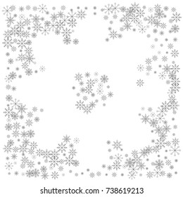 Christmas snow splash frame or border of a random scatter snowflakes isolated on white. Snow explosion. Ice storm.