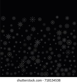 Christmas snow spray background of a random scatter snowflakes isolated on black. Snow explosion. Ice storm.