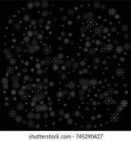 Christmas snow spray background of a random scatter snowflakes isolated on black. Snow explosion. Ice storm.